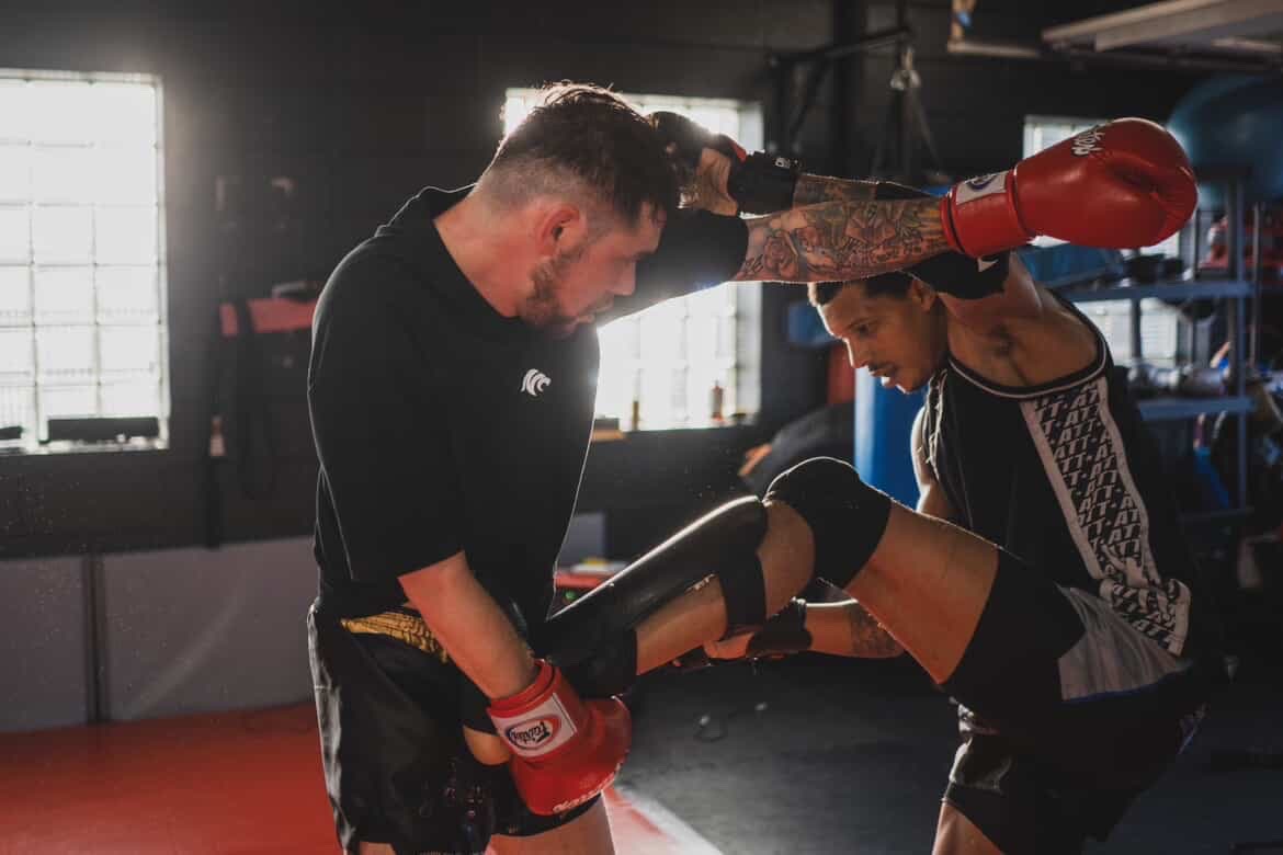 Cody training Muay Thai kicks and knee strikes